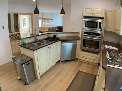 a kitchen with a sink and a stove top oven at Eleanor Lodge - Entire House in Blue River in Blue River