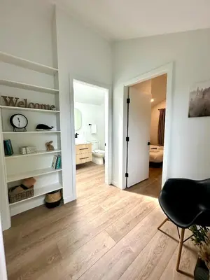 a room with a bathroom with a toilet and a mirror at cottage NOMAD in Ucluelet