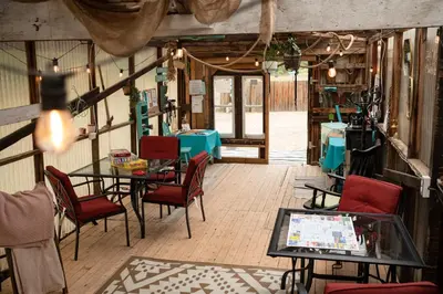 a room with a table and chairs and a tableasteryasteryasteryasteryasteryastery at D4 Badlands Bunker Dome- 1 Queen Pet Friendly in Drumheller