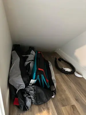 a pile of bags sitting on the floor in a room at K202 Hot tub, Pool, MTN view, AC, free parking in Canmore