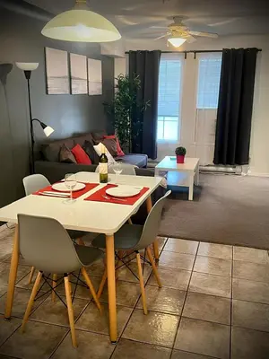 a dining table and chairs in a living room at Modern Condo Dream at Fairmont in Fairmont Hot Springs