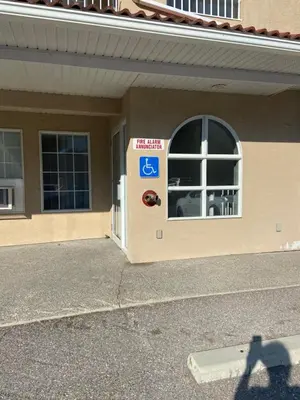 a door to a building with a sign on it at Modern Condo Dream at Fairmont in Fairmont Hot Springs