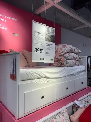 a display of a bed on display in a store at Boutique Beach Apartment in Vancouver
