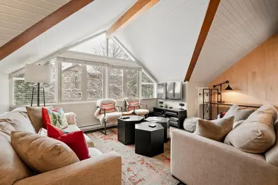a living room with two couches and a table at The Crest, Spacious, Central Condo, Free Parking in Whistler