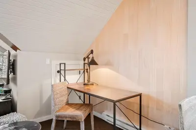 a desk and a chair in a room at The Crest, Spacious, Central Condo, Free Parking in Whistler