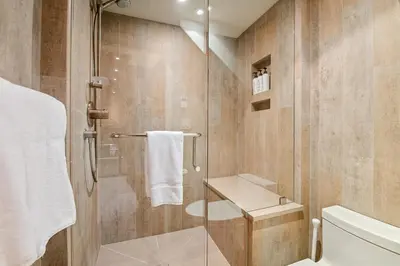 a bathroom with a shower and a toilet at The Nest, Central, Luxury Unit, Free Parking in Whistler