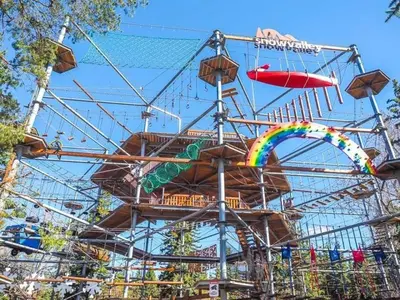 a roller coaster with a rainbow on it at Charming 2-Bedroom Basement Oasis Sleeps 5,Size-150sqm, Netflix, family friendly in Edmonton