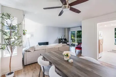 a living room with a table and a couch at Entire home minutes from 3 lakes and a river! in Nanaimo