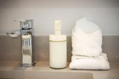 a bathroom with a roll of toilet paper next to a sink at Charming 3BR Home in a Lovely Vancouver Neighborhood in Vancouver