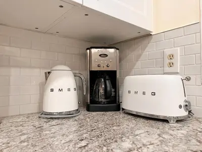 two coffee makers sitting on a counter in a kitchen at B212 Hot Tub, AC x3, parking, 2 min to Banff Gate in Canmore