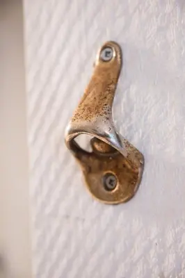 a metal door handle on a white door at Creekside Oasis 4 Beds Pool and Hot Tub in Whistler
