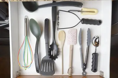 a drawer filled with utensils in a white box at Best Ski-in out 3 Bdrm Chalet, with Hot Tub in Big White