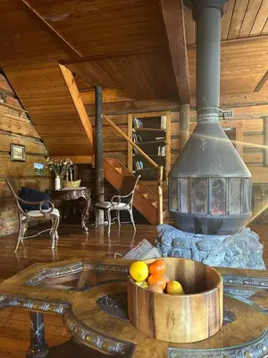 a room with a stove with a bowl of fruit at Rustic Beaverfoot Lodge Room N5 in Parson
