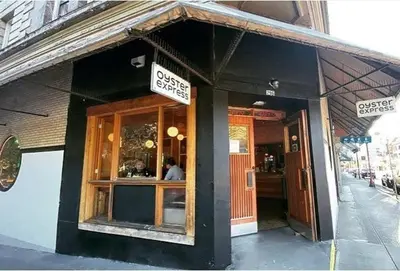a restaurant with a sign on the front of it at Cozy 1BR with AC, Chinatown, Rogers Arena, Seawall in Vancouver