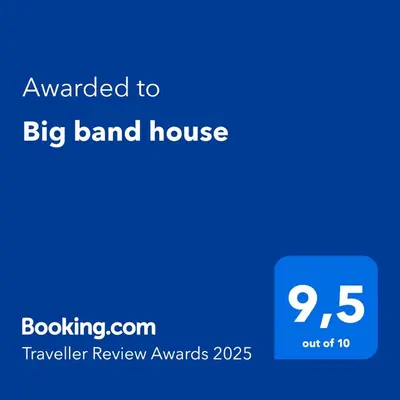 a blue sign that says awarded to a big band house at Big band house in Burnaby