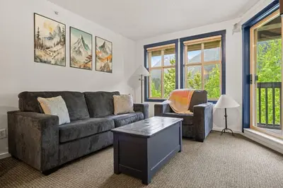 a living room with a couch and two chairs at Reach Your Peak, Ski In, Ski Out, Pool, Hot Tub in Panorama