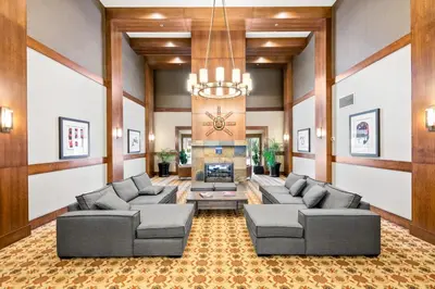 a living room with couches and a fireplace at Ski In & Out, Heart of Upper Village in Whistler