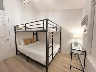 a bedroom with a bunk bed in a room at B233 Mountain View 2BD 2BT AC BonFire BBQ Townhome Close to Banff in Canmore