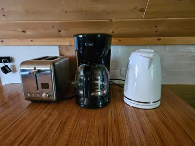 a coffee maker and a toaster sitting on a counter at Carriage House - 2 suites- HIKE & REST - EV plug in Golden