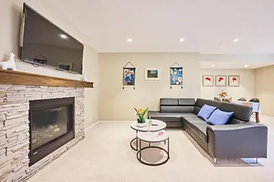 a living room with a couch and a fireplace at sweet home in Calgary