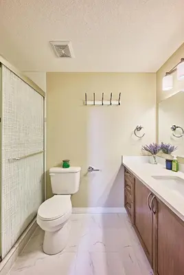 a bathroom with a toilet and a sink at sweet home in Calgary