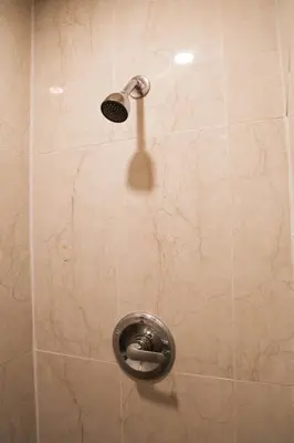 a shower with a shower head in a bathroom at Chic Artistic Studio Suite Exceptional Luxury with Everything You Need NO need to SHARE Room in Richmond