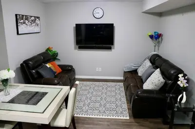 a living room with a couch and a table at Parkside Luxury Stay with Xbox Entertainment in Calgary