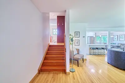 a hallway leading to a living room and dining room at Chinook Executive Entire House in Calgary