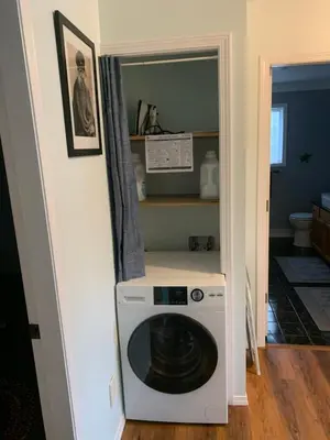 a washer and dryer in a small room at Best Bed and Breakfast in Port Alberni