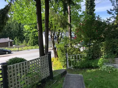 a fence on the side of a street at Cozy and Friendly Home Single Room No Pets Allowed in Burnaby