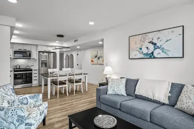 a living room with a couch and a table at T202 BRAND NEW! The Mountain's Call- Mountain View Stay in Canmore