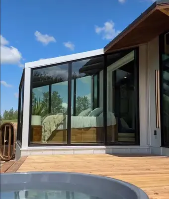 a glass house with a bed inside of it at Refuge Bay Caelum Cabin Luxury Off Grid Escape in Cherhill