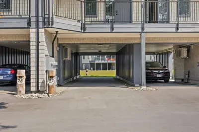 a parking garage with two cars parked in it at Ocean View Townhouse #27 in Oyster Bay