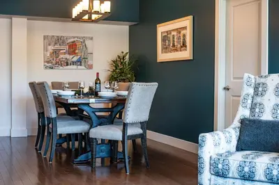 a dining room with a table and chairs at Downunder Mountain Retreat in Revelstoke