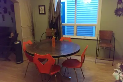 a dining room with a table and chairs and a table and chairs at Mission Historical Home in Calgary