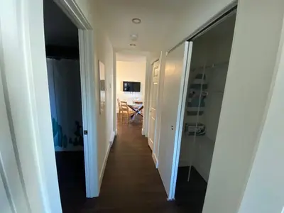 a hallway leading to a room with a dining room at New Dt Apartment Walk To All in Edmonton