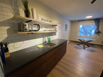 a kitchen with a sink and a counter top at Close To Whyte University New Renovation in Edmonton