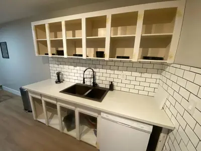 a kitchen with a sink and a counter top at Morden Newly Renovated 1br Flats, Walk To Whyte in Edmonton
