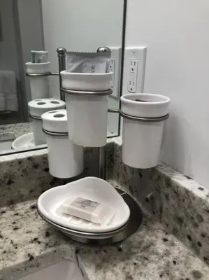 a bathroom with a toilet and a mirror at Modern luxury and convenience in Marda Loop in Calgary