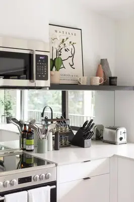 a kitchen with a microwave and a stove top oven at Casa Bramble Luxury 2Bed Suite near UofA Hospital in Edmonton