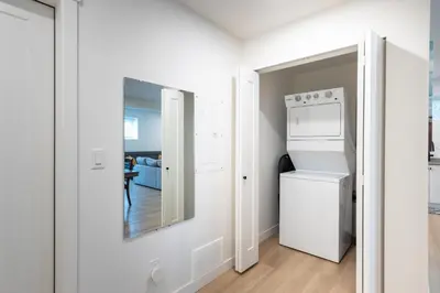 a white laundry room with a washer and dryer at Sunflower Brandnew Cozy Private Suite in Langley