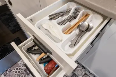 an open drawer in a kitchen with utensils at Sunflower Brandnew Cozy Private Suite in Langley