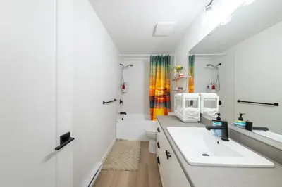 a bathroom with a sink and a toilet at Sunflower Brandnew Cozy Private Suite in Langley