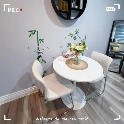 a white dining room table with white chairs and a vase of flowers at Cozy Private suite-Free parking-Netflix-Separate entrance-Self Check in in Richmond