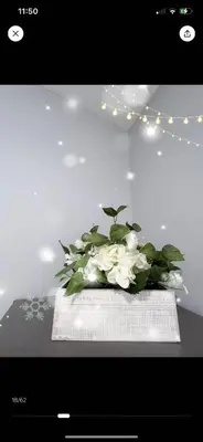a vase of white flowers sitting on a table at Cozy Private suite-Free parking-Netflix-Separate entrance-Self Check in in Richmond