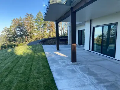 a porch of a house with a grass yard at Winchelsea Views in Nanaimo