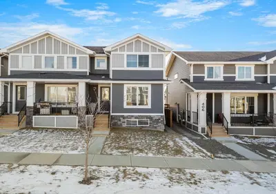 an image of a large house at Mountain Hideaway Two Bedrooms Free Park Pass in Cochrane