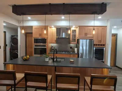a kitchen with a large island in the middle at Skyline Suite 2Bdrm King in Valemount