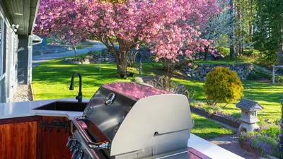 a toaster sitting on a counter next to a garden at Beaver Beach Vacation Home in Madeira Park