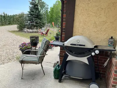 a grill sitting on the side of a house at Tudor House Bed and Breakfast in Bottrel